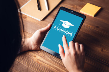 Woman is using tablet and  