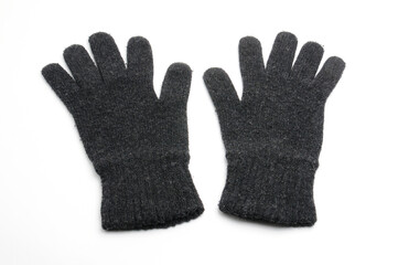 Winter knitted woolen gloves on a white background