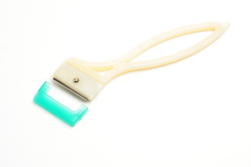 Fruit and vegetable scraper on a white background