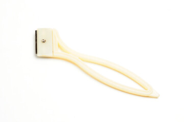 Fruit and vegetable scraper on a white background