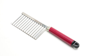 Wavy knife for slicing french fries, vegetable chips and fruits on a white background