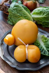 Cheese collection, Italian cheeses provolone, caciocavallo, scamorza made from sheep or cow milk in South Italy, white and yellow smoked.