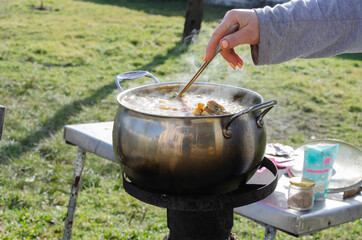 Cooking borscht, soup in the garden. Cooking outdoors during tough times. Without gas and...