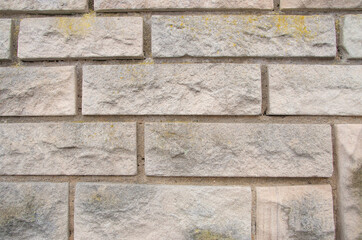 Bright stone facade as texture or background
