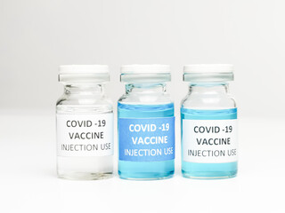 Selective focus a row of COVID 19 VACCINE isolated on white background.