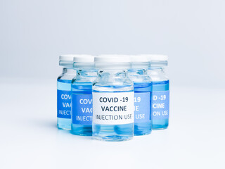 Selective focus a row of COVID 19 VACCINE isolated on white background.