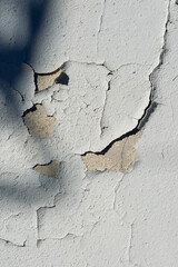 A wall with peeling plaster