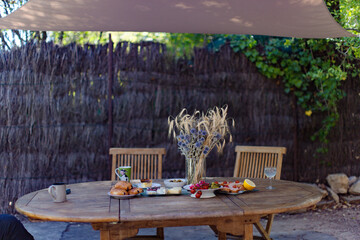 Breakfast on the table in the yard in the summertime