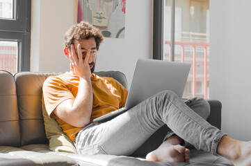 young bearded man feeling bored, frustrated and sleepy after a tiresome, dull and tedious task,...