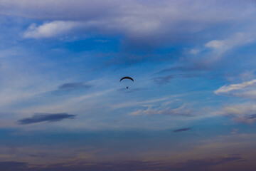 Paragliding under the blue sky