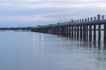 Fototapeta na wymiar Pier bridge at the coastline