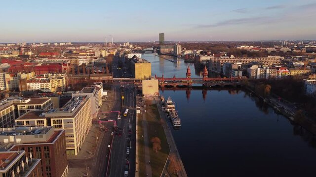 Amazing Oberbaum Bridge in Berlin at sunset - aerial view. Amazing drone footage