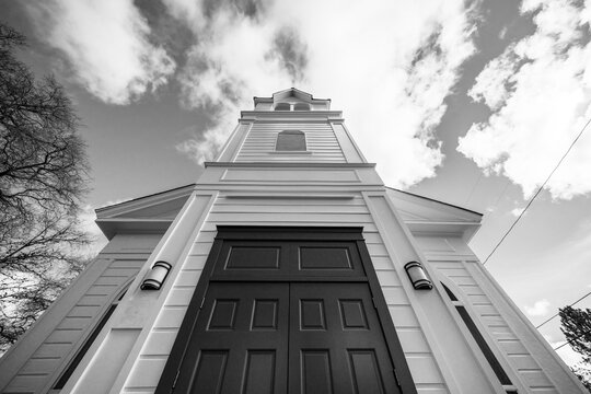 A black and white photo of the exterior of a historic church