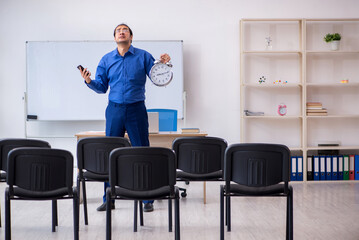 Young male business trainer making presentation during pandemic