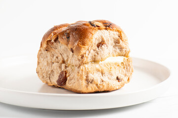 Fresh baked traditional Easter hot cross buns with raisins.