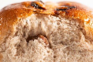 Fresh baked traditional Easter hot cross buns with raisins.