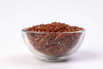 Brown low glycaemic index gi rice in glass bowl on white background