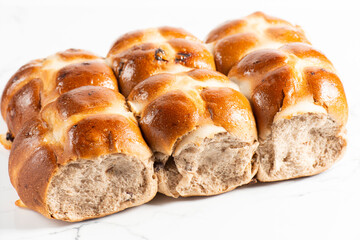 Fresh baked traditional Easter hot cross buns with raisins.