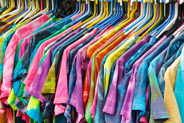 Multi Coloered Tie-dyed T-Shirts Hanging on a Rack