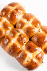 Fresh baked traditional Easter hot cross buns with raisins.