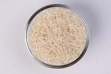 Short grain pilaf polau risotto rice on white background