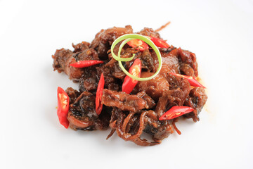 Calamari or Squid in Oyster Sauce, Made from Squid Cooked with Chilies, Onions, Flavoring, Tomato Chili Sauce, and Oyster Sauce. Served Isolated on White Plate