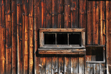 old wooden window on rotting wall