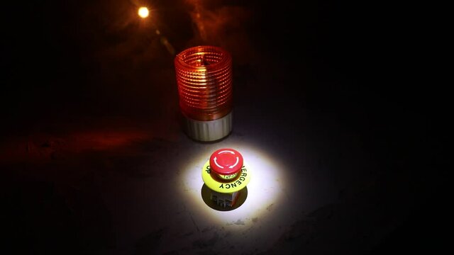 Emergency stop button, Disaster protection. Industrial concept. Red button on table in dark low key background. Selective focus