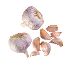 falling garlic onion and garlic cloves isolated on a white background