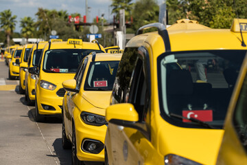 Line of taxi service cars waiting for passengers in Turkey