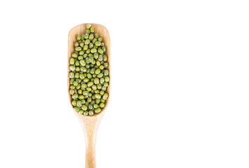 A spoonful of mung beans on a white background