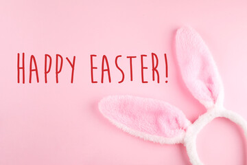 Happy Easter background. Greeting Card. Bunny rabbits on pink background. Easter minimal concept