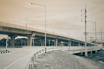 Elevated Way or Highway and Road and Street Light Pole on Sky Background in Vintage Tone