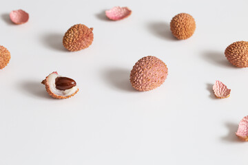 Fresh Lychee fruit on light background. Minimal fruit and summer concept.
