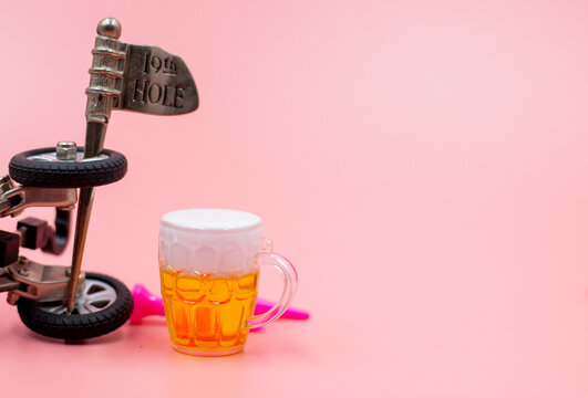 Golf at 19th Hole with Beer on pink background