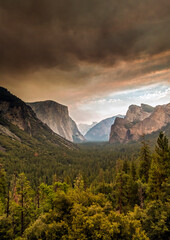dark smoke clouds cover the skies in Yosemite national park during a summer forest fire. It turned the skies into color orange.