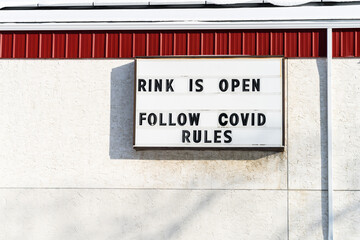 Follow COVID rules notice on community center