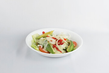 Closeup of salad with avocado and tomatoes