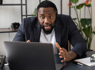 Angry boss talking chat with to his coworker using laptop. Video call, self-isolation concept