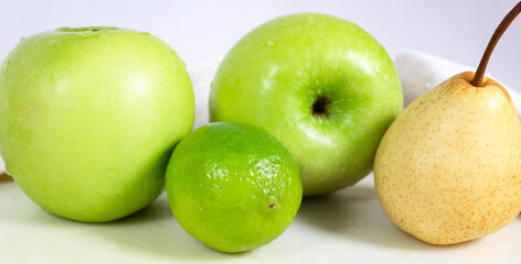Fresh green fruit close-up on the table. The concept of diet and healthy eating.
