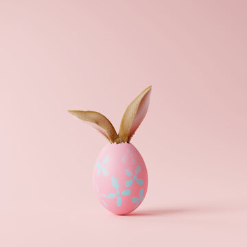 Creative easter egg with rabbit ears on pastel pink background. Minimal concept. 3d rendering
