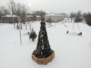 Aerial view of the New Year tree in Lyangasovo in winter (Kirov, Russia)