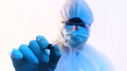  Young medical technician performing nasal swab covid-19 test. High quality photo
