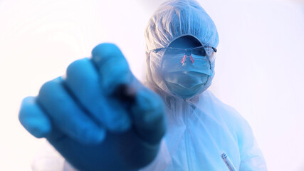 Vertical. Young african american black medical technician performing nasal swab covid-19 test. High...