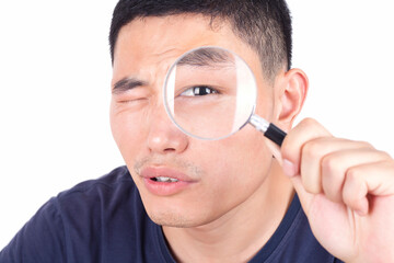 Fototapeta na wymiar A boy with a magnifying glass