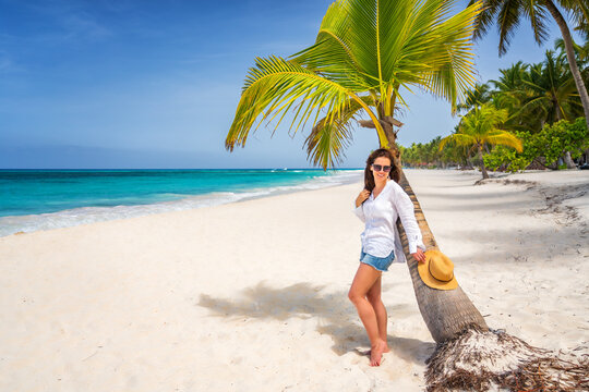 Young woman on the beautiful ocean beach in Dominican Republic