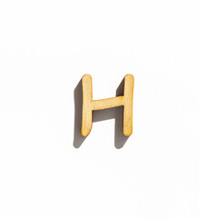 wooden classic letter h isolated on a white background, english alphabet from natural materials for children, eco friendly concept