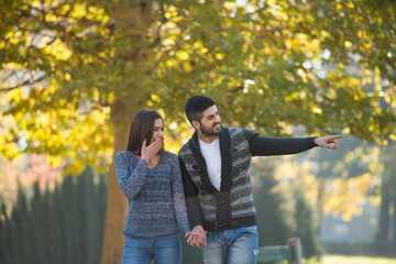Lovers Walking Hand In Hand In Autumn Park