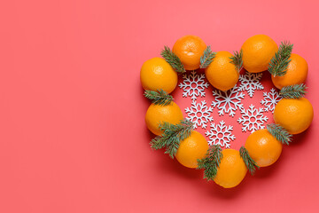 Heart made of oranges on color background