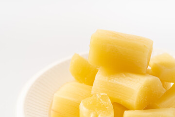 Fresh sugar cane chunks on pure white background